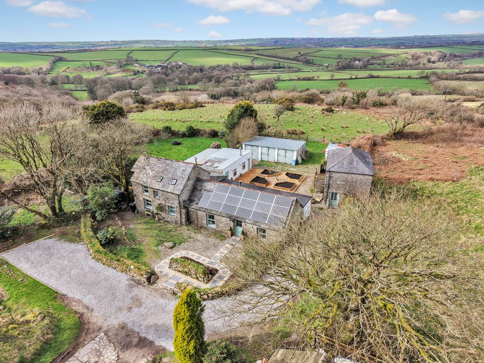 A building with solar panels and a gravel driveway at Tor Farm in Advent near Camelford