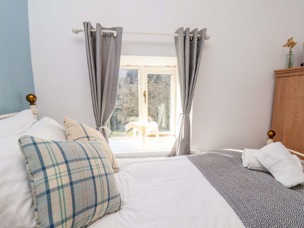 A bedroom with a bed and window in 1 Rosedale Abbey