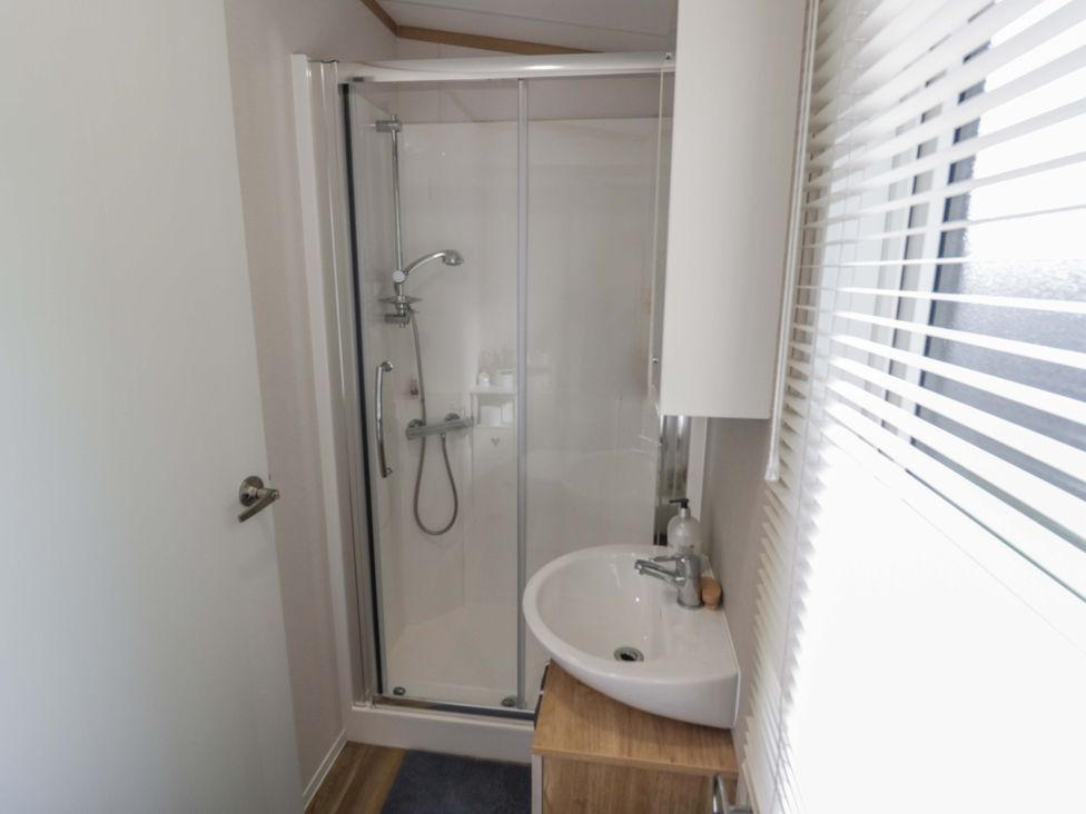 A bathroom with a shower and sink at AV18 Tiddington