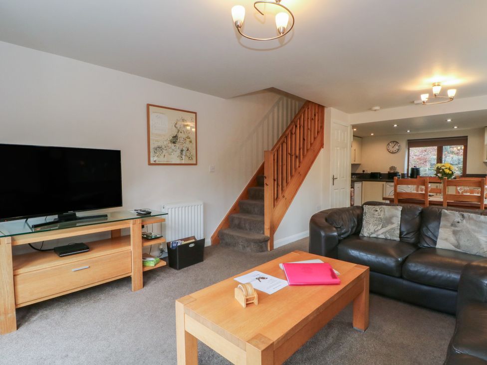A living room with a television and sofa at Victoria Wood View, Cragg Vale