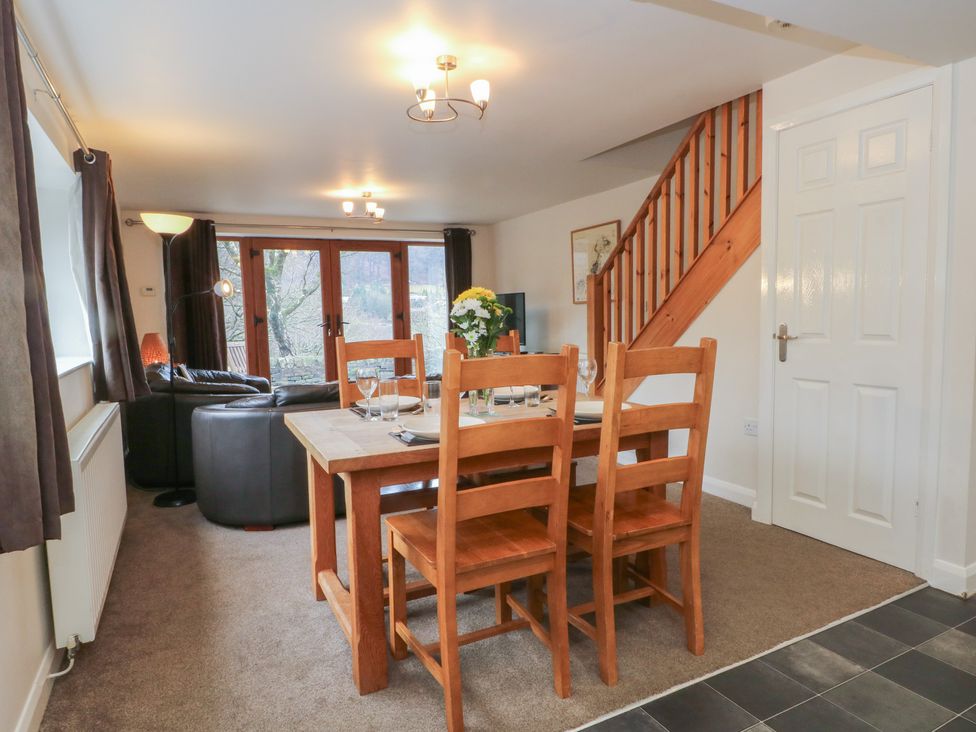 A dining area with a table and chairs at Victoria Wood View in Cragg Vale
