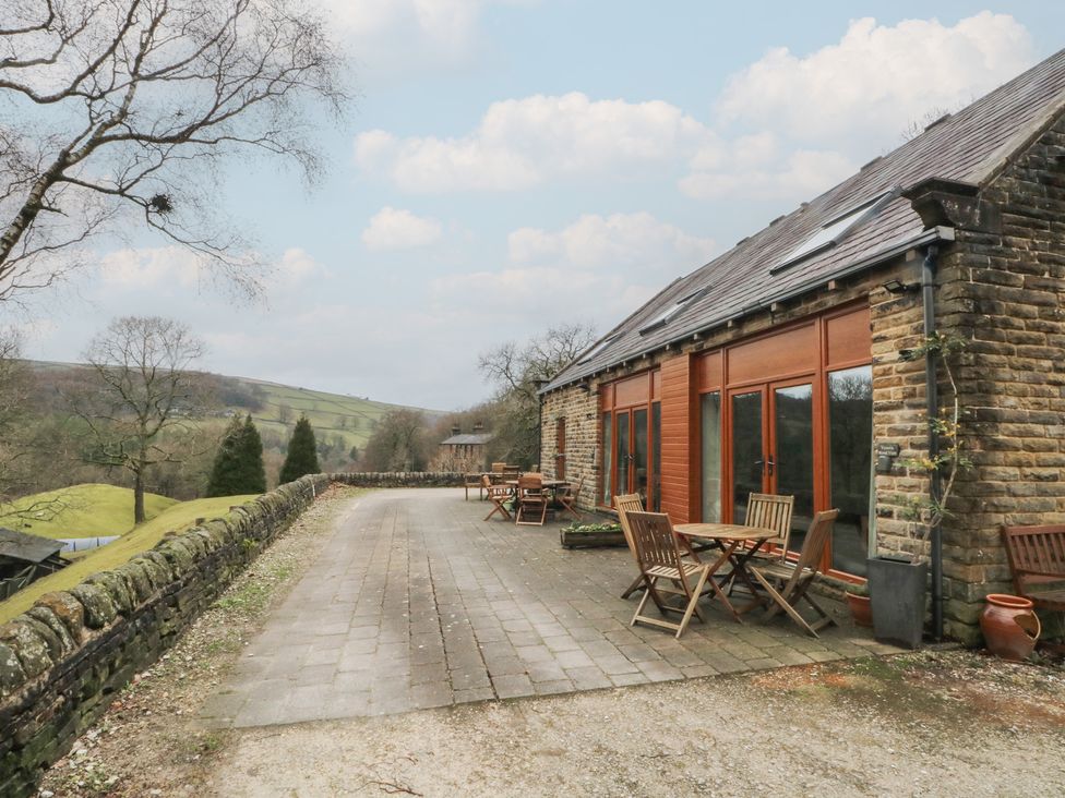 An outdoor area with tables and chairs at Victoria Wood View in Cragg Vale