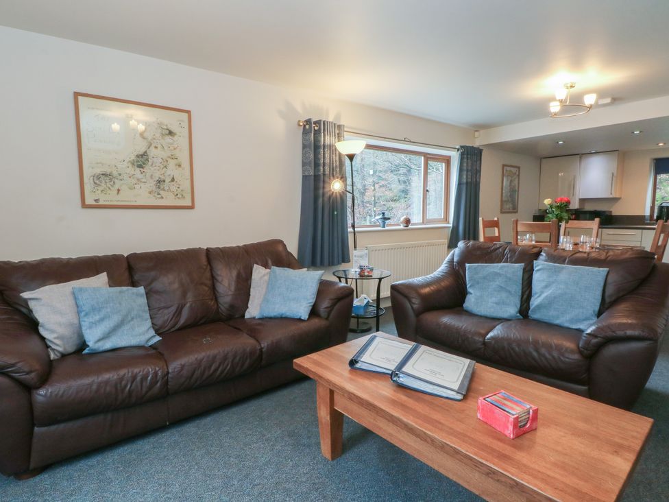 A living room with sofas and a table at Cragg Hall View Cragg Vale