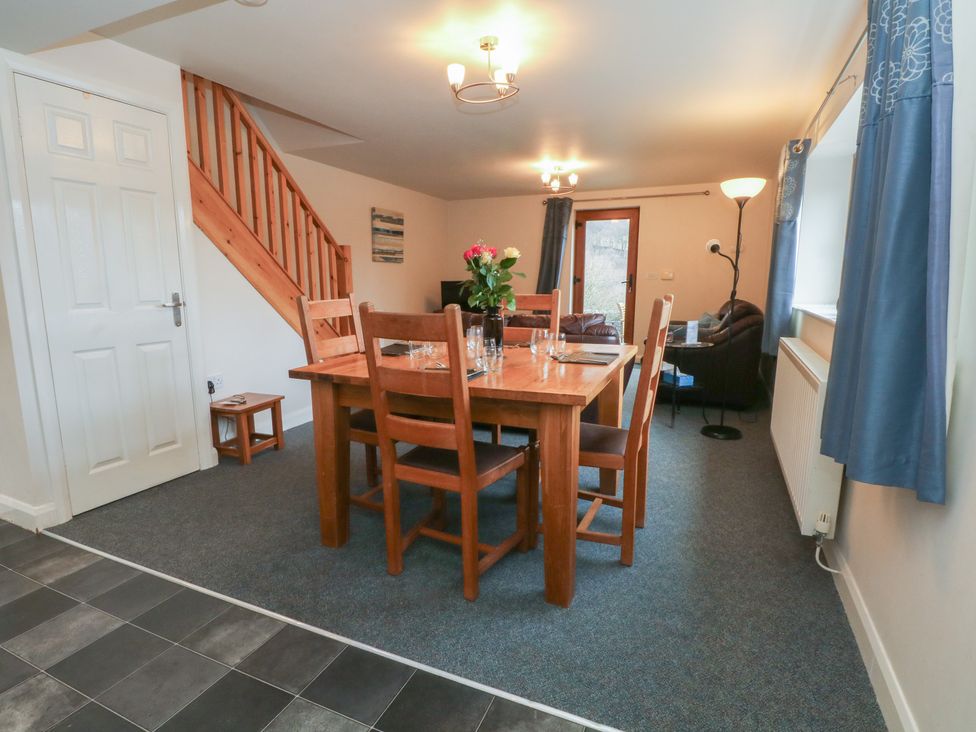 A dining area with table and chairs at Cragg Hall View in Cragg Vale
