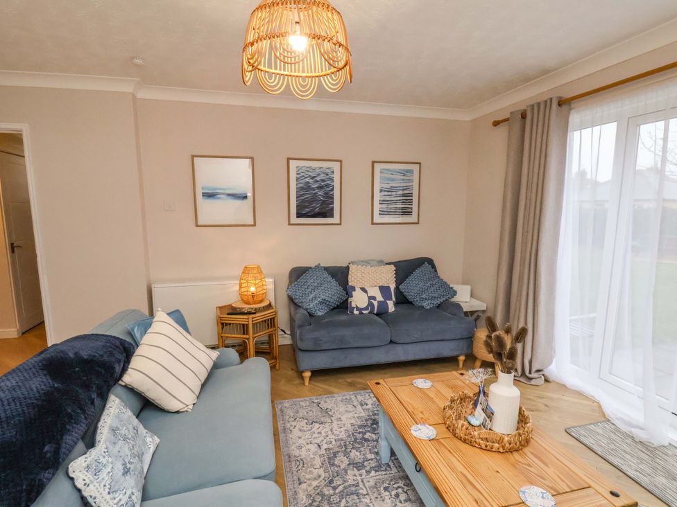 A living room with a sofa and coffee table at Flat 1, 40 Hinderwell Lane