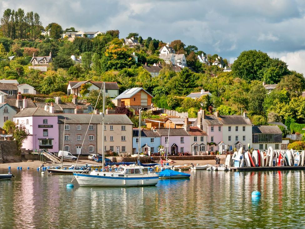 A waterfront view with houses and boats at Capton Snug Dartmouth