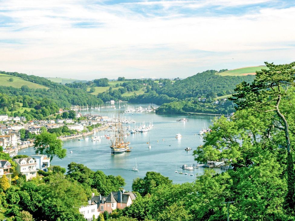 A view of a river with boats and hills at Capton Snug in Dartmouth