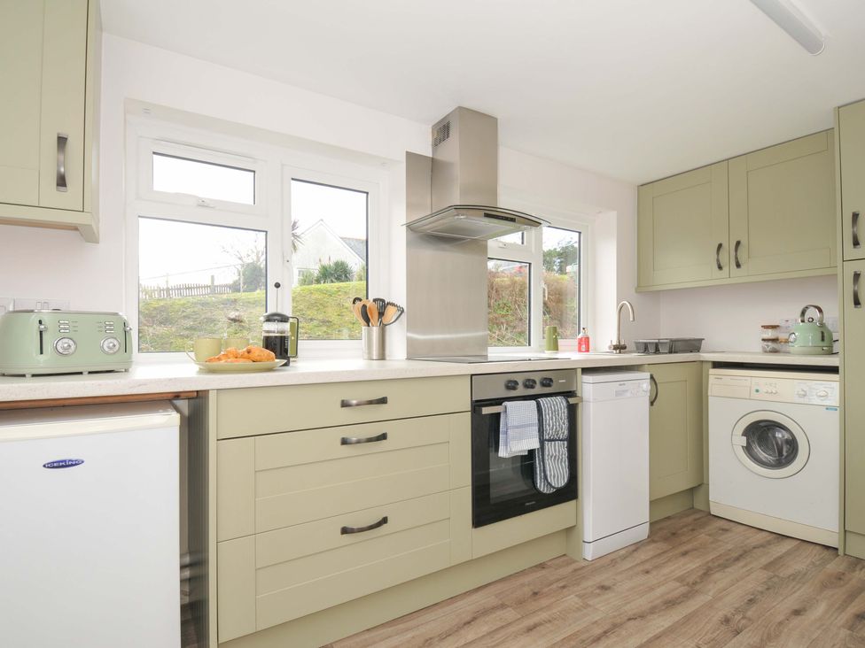 A kitchen with appliances and countertop at Casa Mia in Porthpean near St Austell