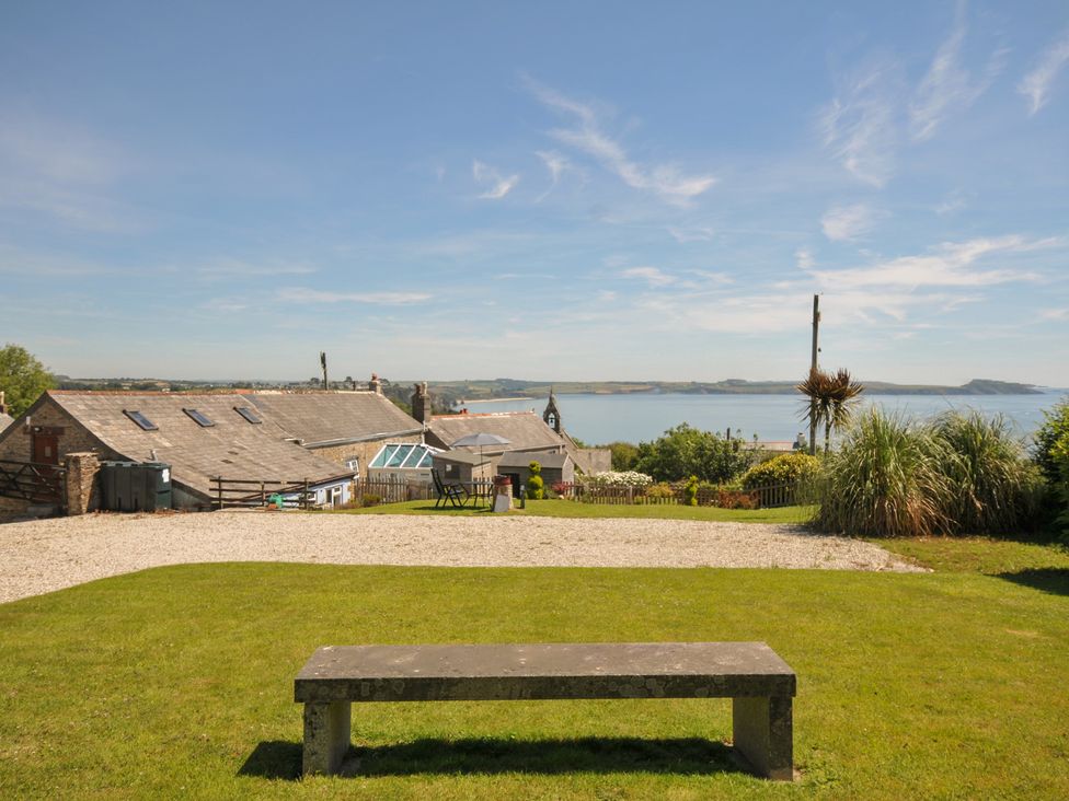 An outdoor area with a view of a body of water and buildings at Casa Mia in Porthpean near St Austell