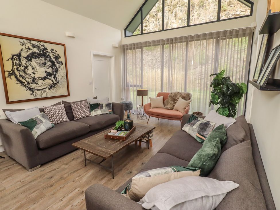 A living room with a sofa and coffee table at Summerset Lodge in Bamburgh