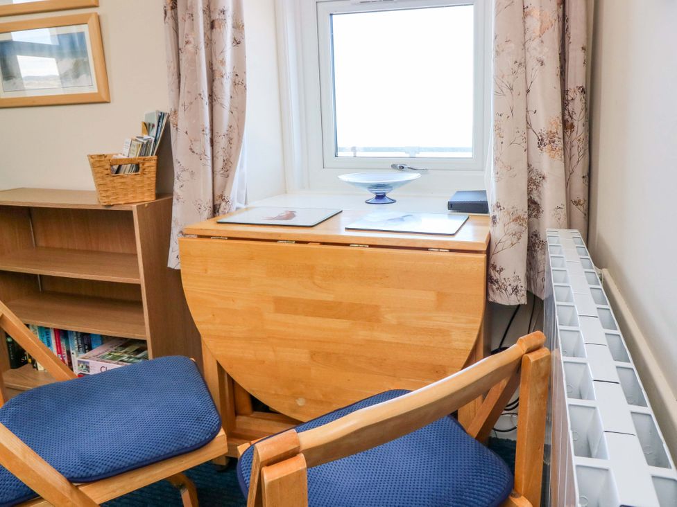 A study with a table and two chairs at The Flaghouse at The Lighthouse St Abbs