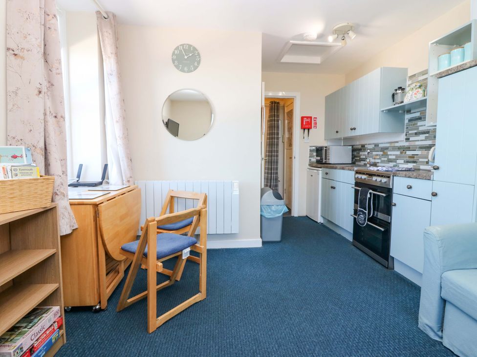 A kitchen area with a desk and chair at The Flaghouse at The Lighthouse St Abbs