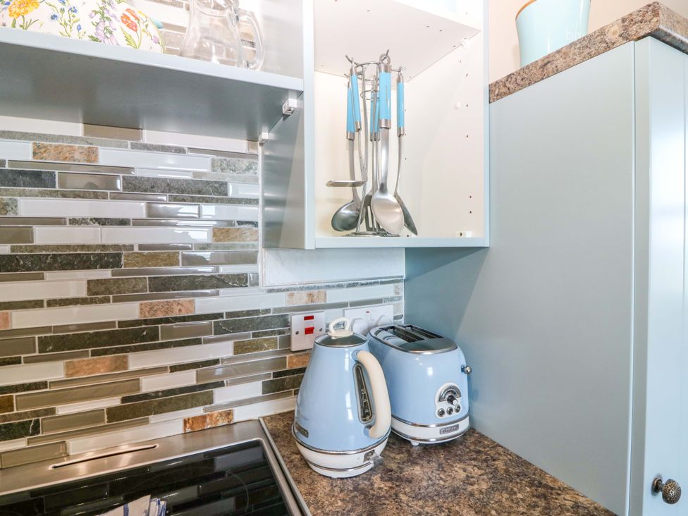 A kitchen with a kettle and toaster at The Flaghouse at The Lighthouse St Abbs