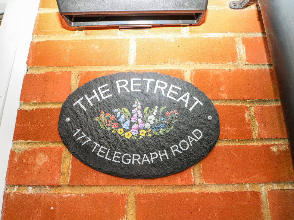 A nameplate for The Retreat at 177 Telegraph Road