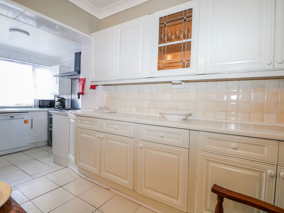 A kitchen with cabinets and countertop at The Retreat in Deal