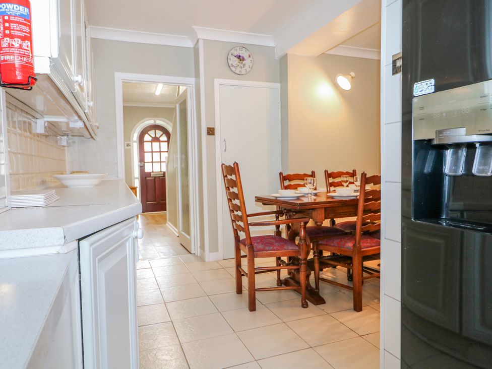 A kitchen with dining table and chairs at The Retreat in Deal