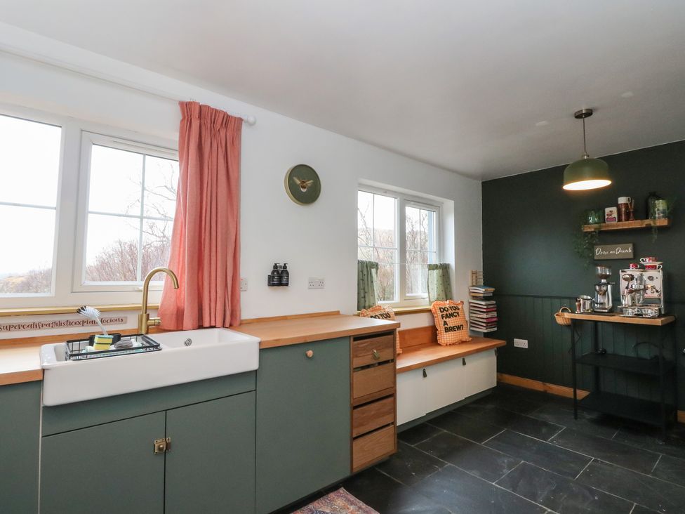 A kitchen with a sink and shelving at Doire An Daimh 