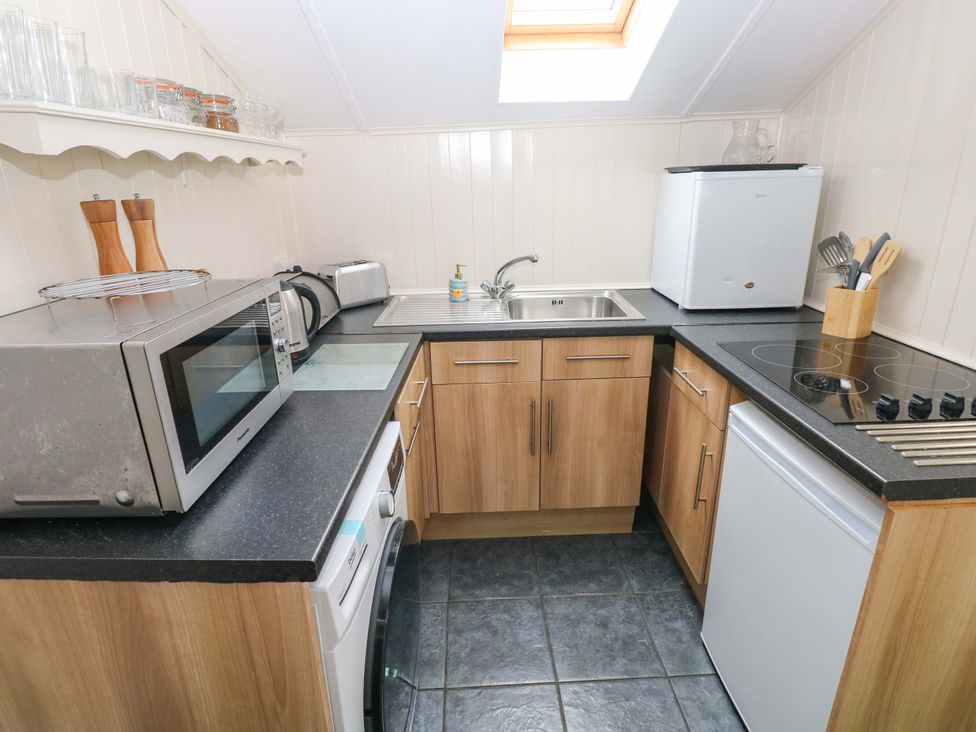 A kitchen with appliances and countertop at Beacon House Marloes near Little Haven