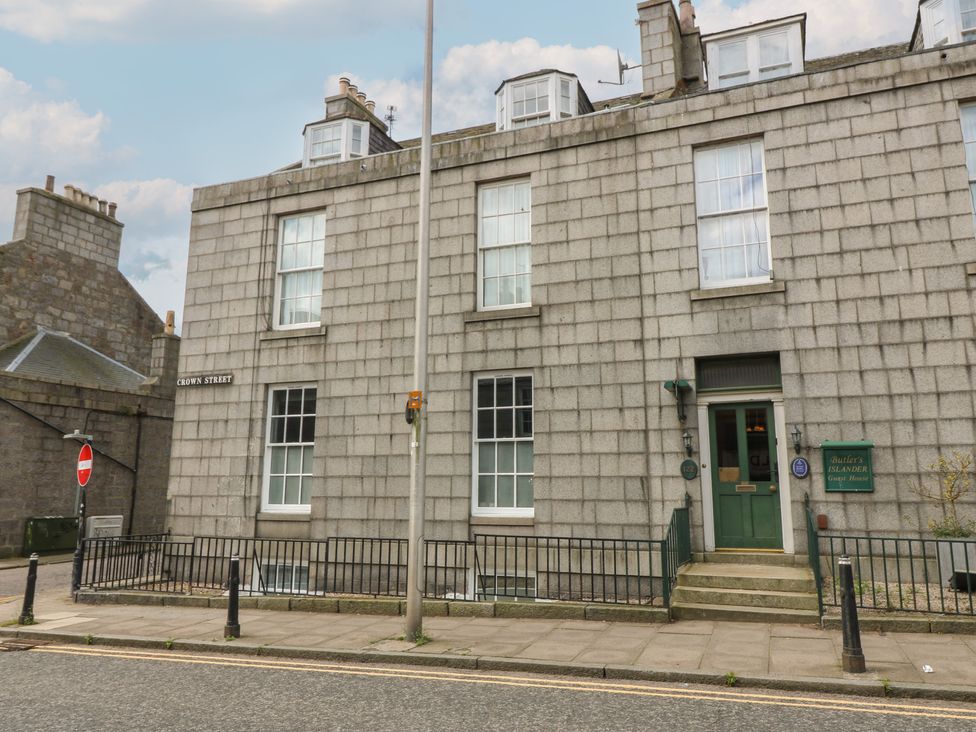 A building exterior with windows and a door at Pincerna Apartment Suite 1a in Aberdeen
