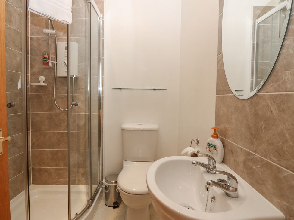A bathroom with shower toilet and sink at Pincerna Apartment Suite 1a in Aberdeen