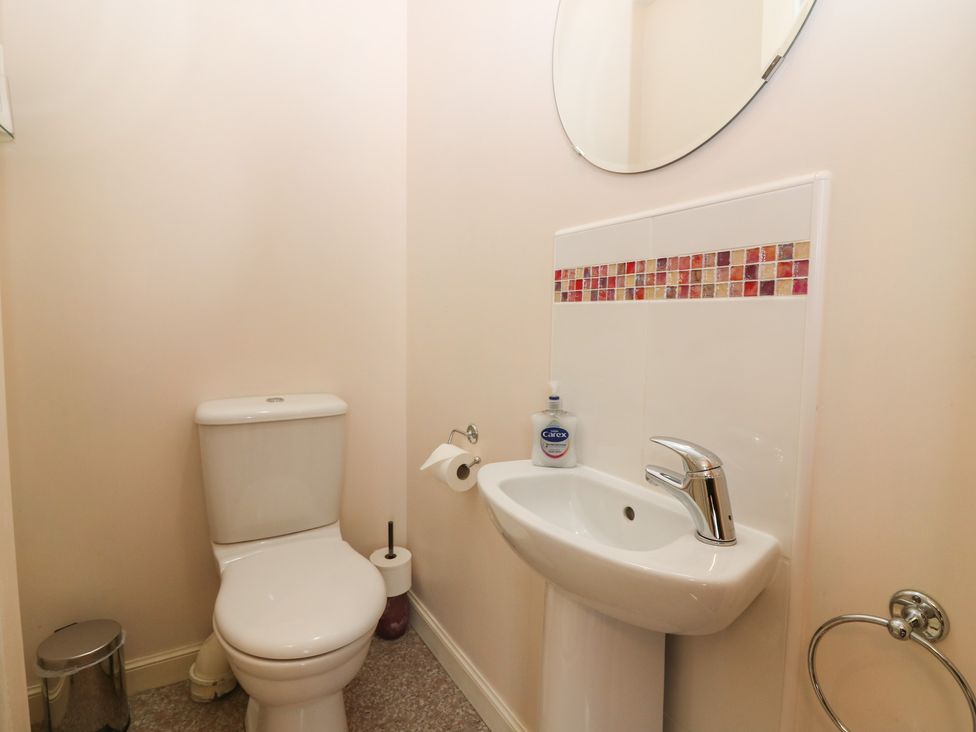 A bathroom with a toilet and sink at Pincerna Apartment Suite 1a, Aberdeen