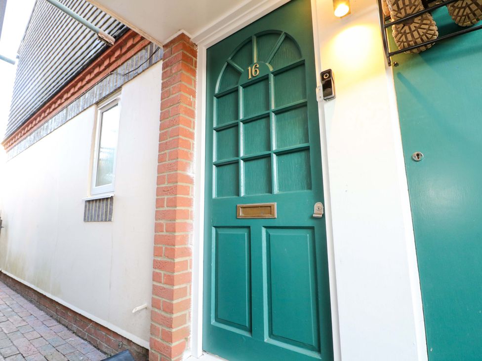 An exterior view of a front door numbered 16 at Flat 16 in Farnham