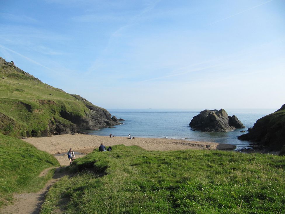 A beach with rocks and people at Hope Cove near Kingsbridge