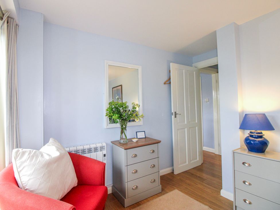 A living room with a sofa and drawer unit at Quay Sands, Hope Cove
