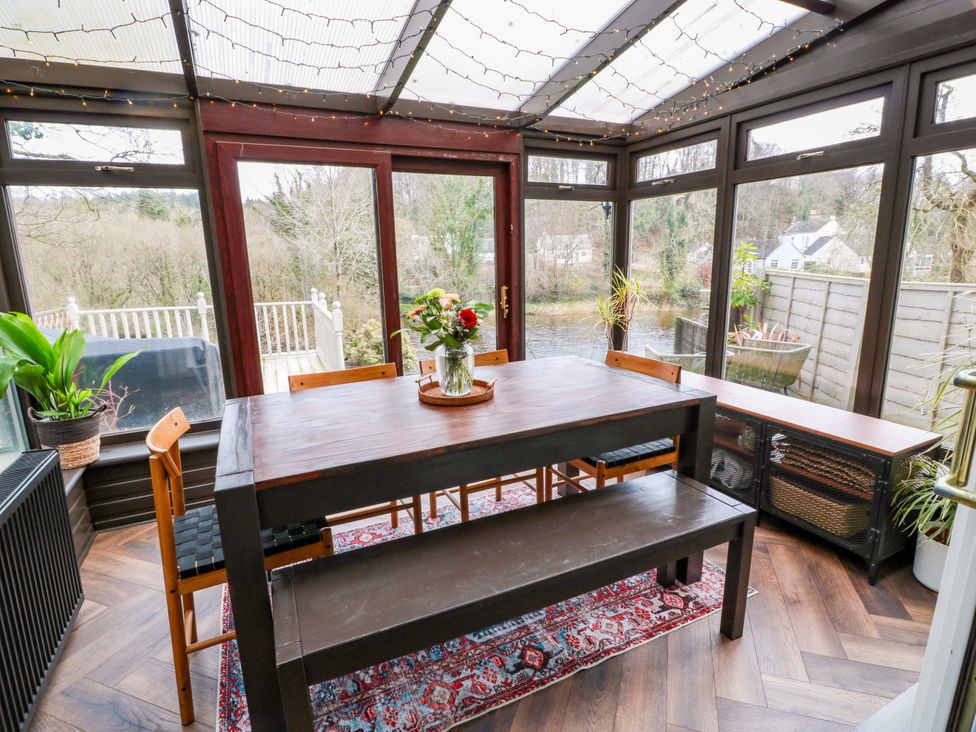 A dining area with a table and chairs at 7 Brewery Pool in Newton Stewart