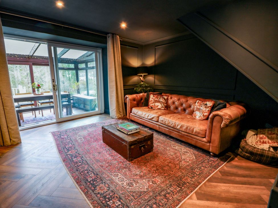 A living room with a sofa and a coffee table at 7 Brewery Pool in Newton Stewart