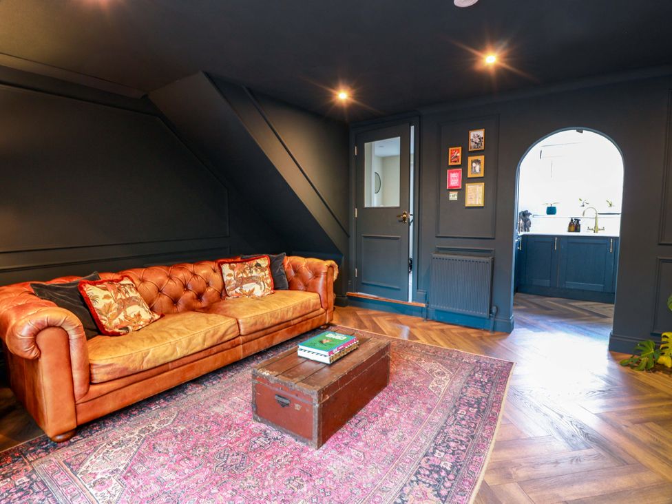 A living room with a sofa and coffee table at 7 Brewery Pool in Newton Stewart