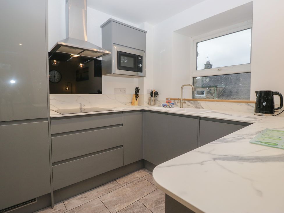 A kitchen with a microwave and kettle at 6 Hallin Fell in Penrith