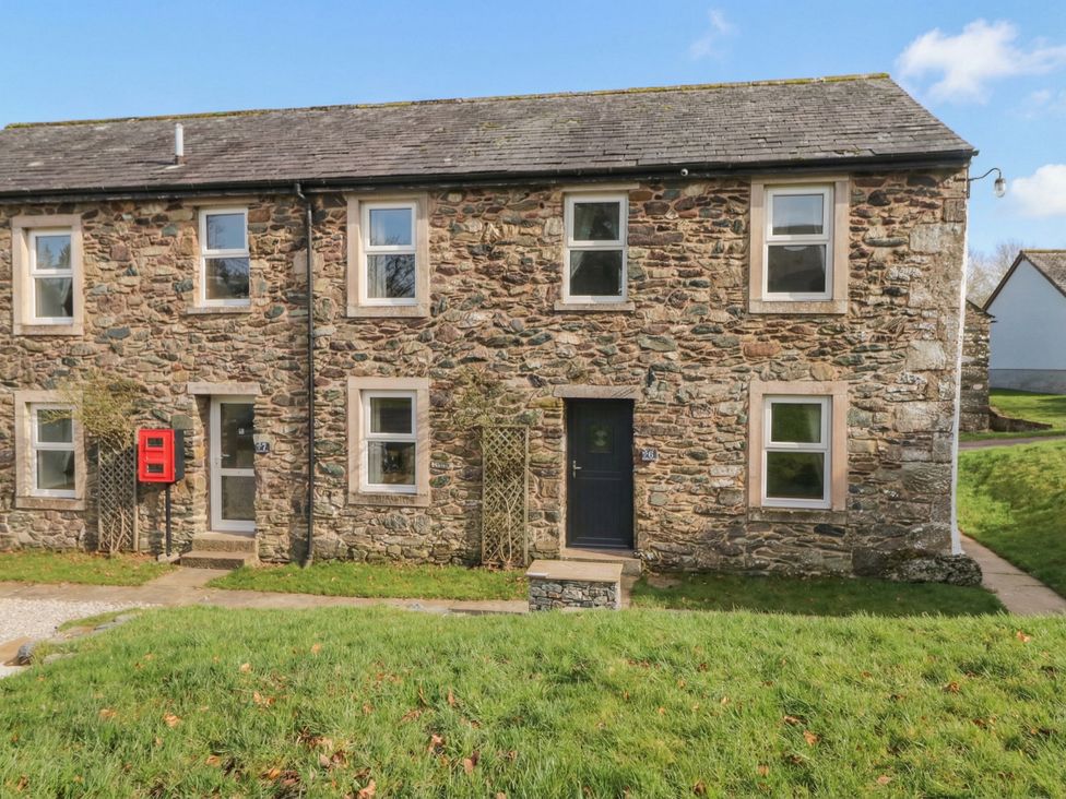 A stone house with a front door and windows at 6 Hallin Fell Penrith