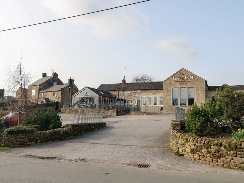 The Gate Inn with outdoor seating area and parking at 2 Knoll Mount Matlock