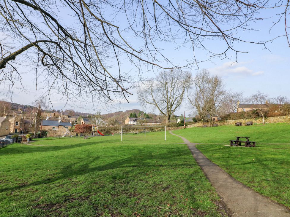 An outdoor area with a football goal and playground equipment at 2 Knoll Mount in Matlock