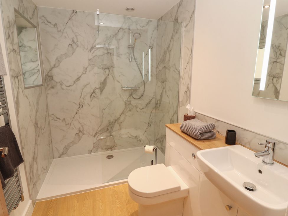 A bathroom with sink and shower at Little Plum Tree in Milnthorpe