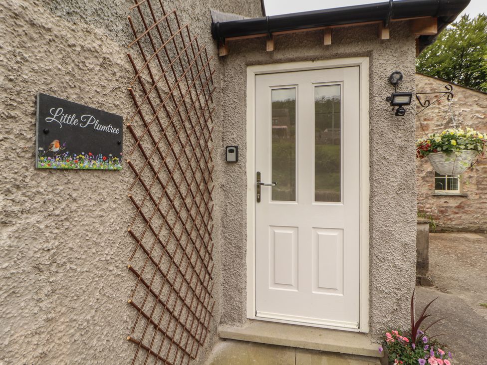 An entrance door with a sign at Little Plumtree in Milnthorpe
