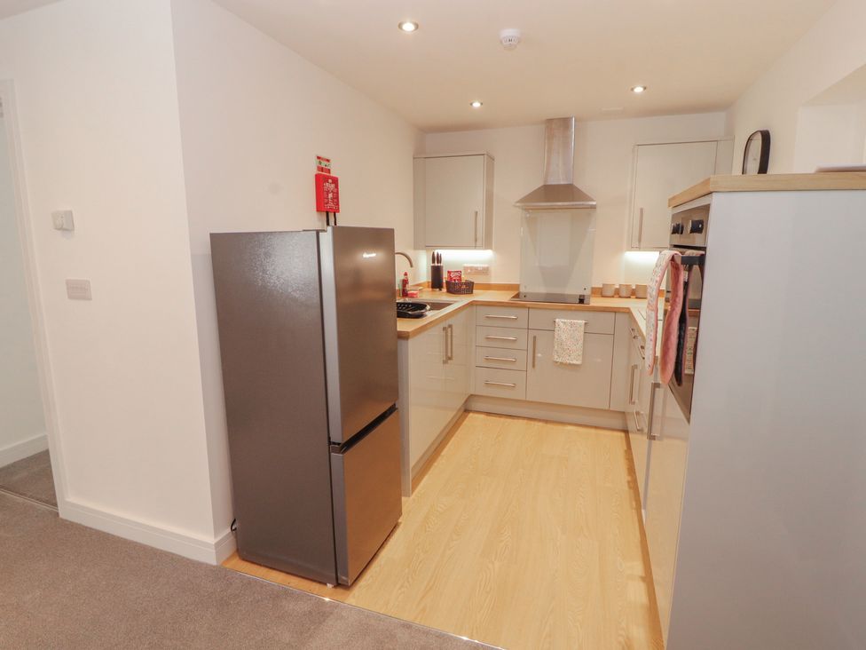 A kitchen with appliances and cabinets at Little Plumtree in Milnthorpe