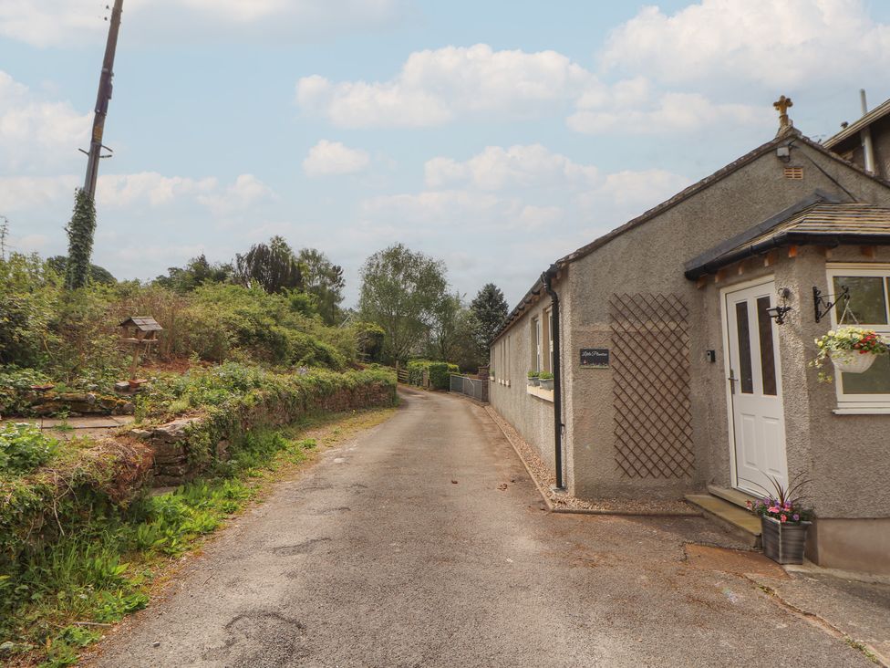 A house with a pathway and greenery at Little Plumtree in Milnthorpe