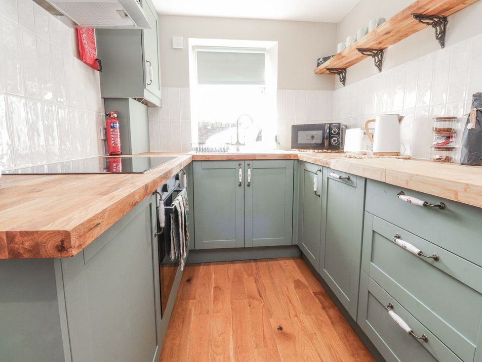 A kitchen with cabinets and countertop at Vasey Croft in Stanbury near Haworth