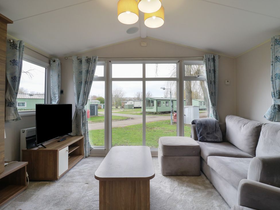 A living room with a sofa and coffee table at MP61 MP Billing Aquadrome Holiday Park Northampton