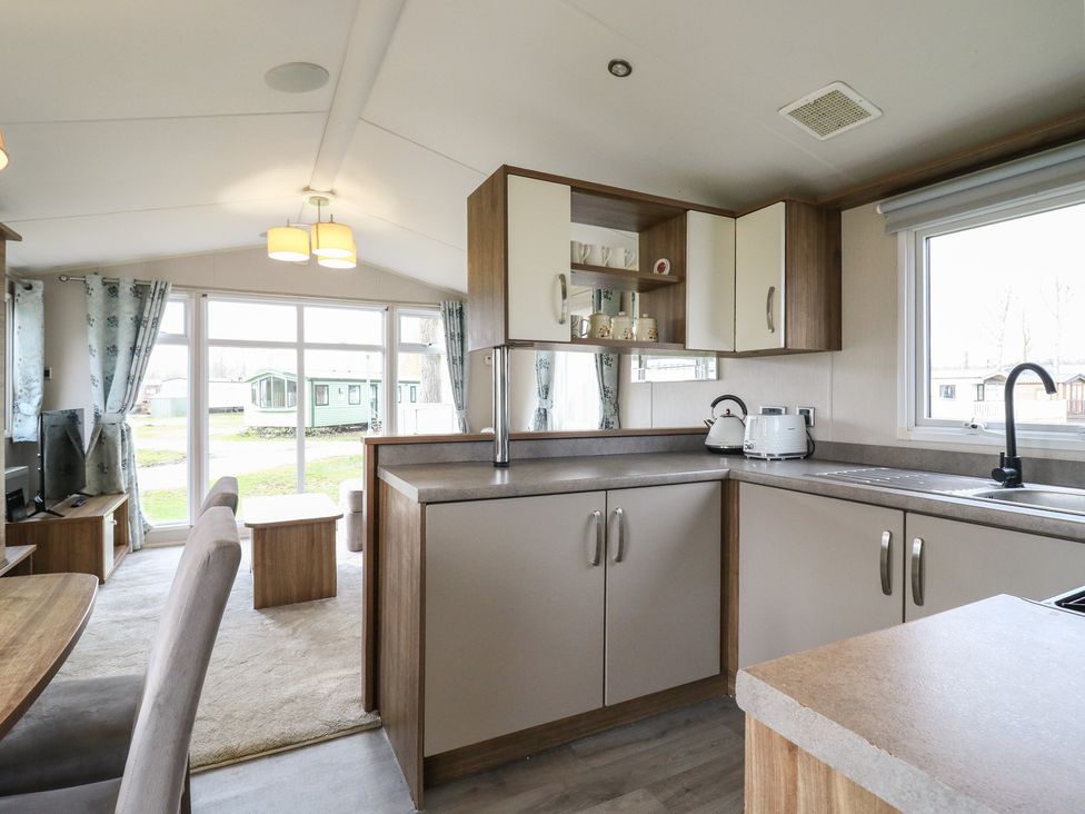 A kitchen with cabinets and a sink at MP61 MP Billing Aquadrome Holiday Park Northampton