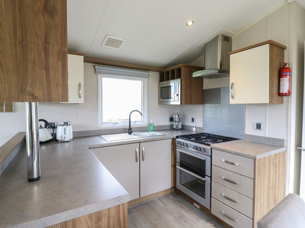 A kitchen with a sink and stove at MP61 MP Billing Aquadrome Holiday Park Northampton