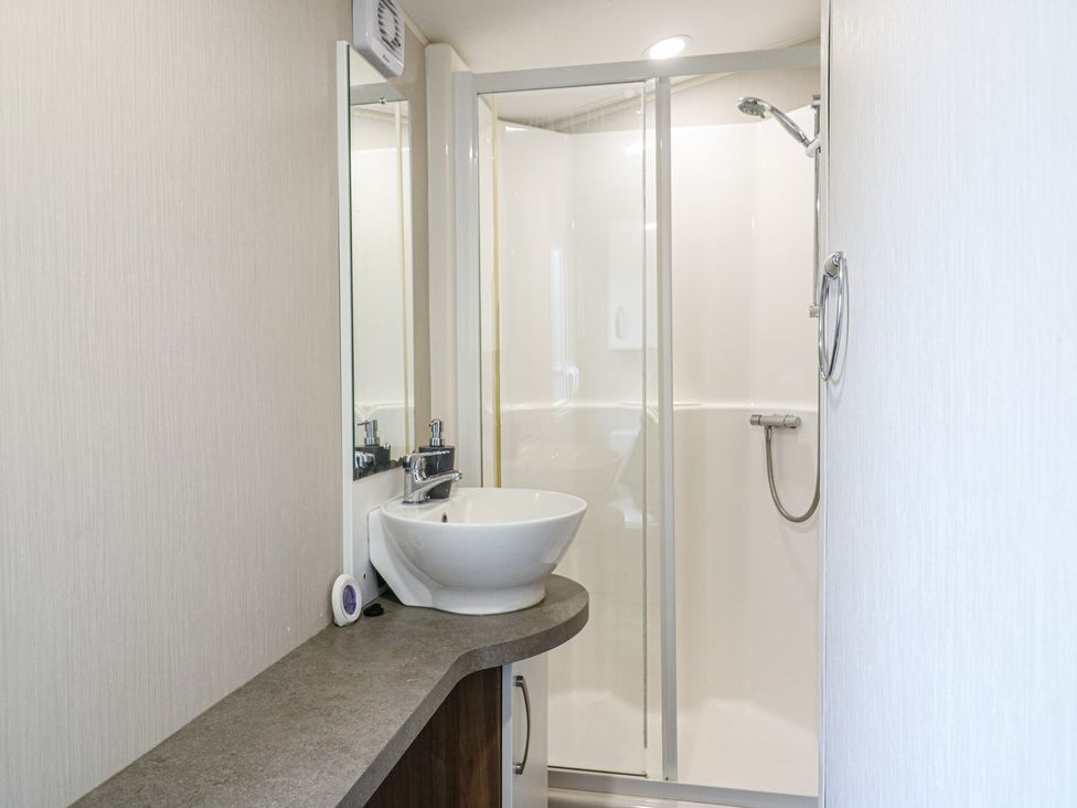 A bathroom with a sink and shower at MP61 MP Billing Aquadrome Holiday Park Northampton