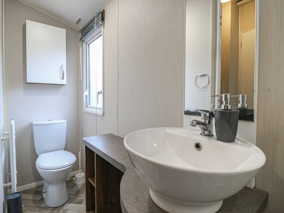 A bathroom with a sink and toilet at MP61 MP Billing Aquadrome Holiday Park in Northampton