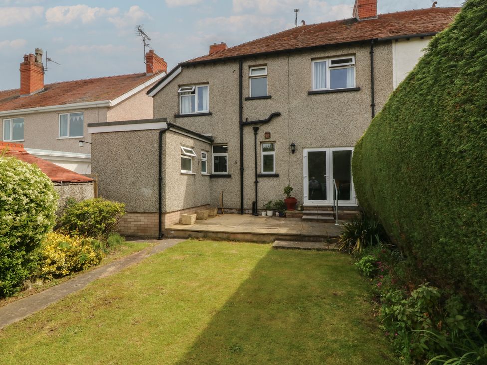 A house with a patio and a garden at Gwynfa in Old Colwyn
