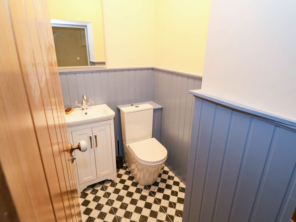 A bathroom with a sink and toilet at The Cottage in Leenane, County Galway