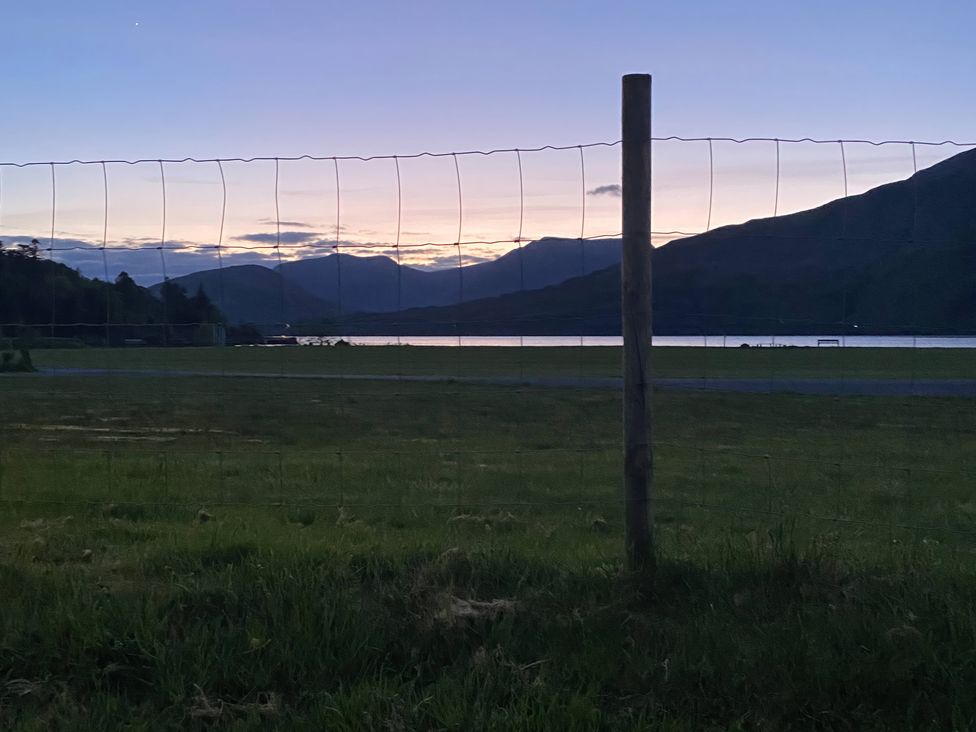 A view of mountains with a lake at The Cottage in Leenane, County Galway
