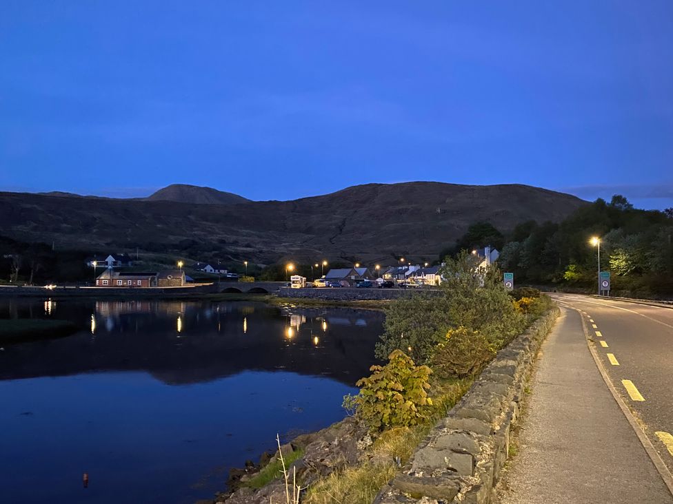 A view of a village near a body of water at The Cottage in Leenane, County Galway