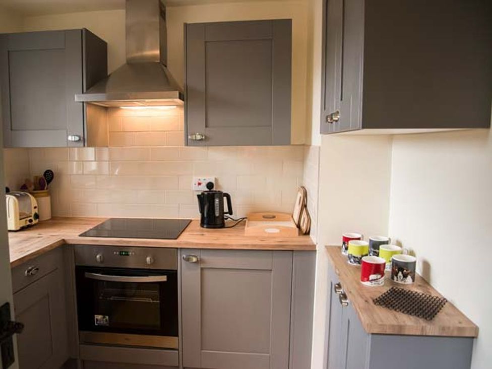 A kitchen with appliances and utensils at Beacon Cottage in Ilkley